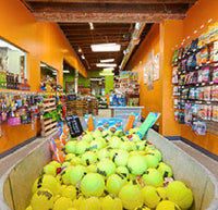 bin filled with tennis balls at our Solana Beach